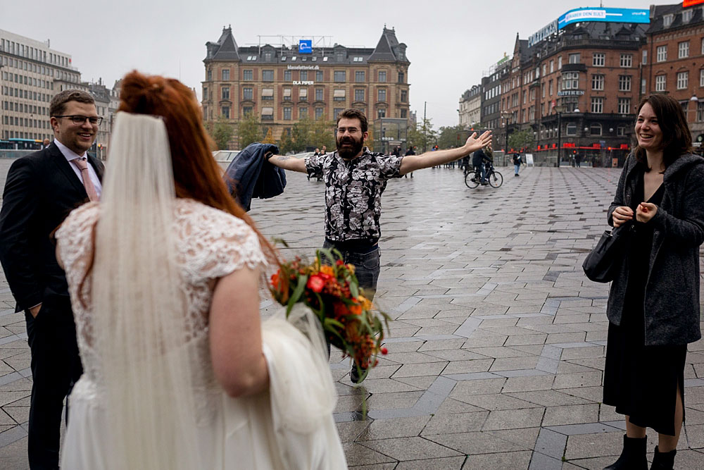 friends congratulating bride and groom after the wedding at Copenhagen city Hall