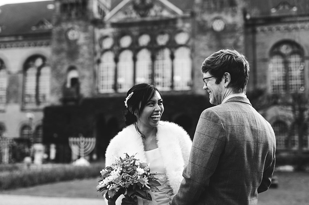 bride and groom in the streets of Copenhagen. Natural wedding photography in Copenhagen.