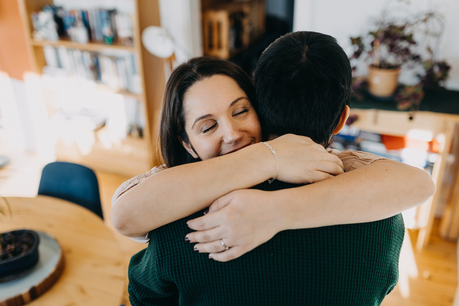 couple hugging at home