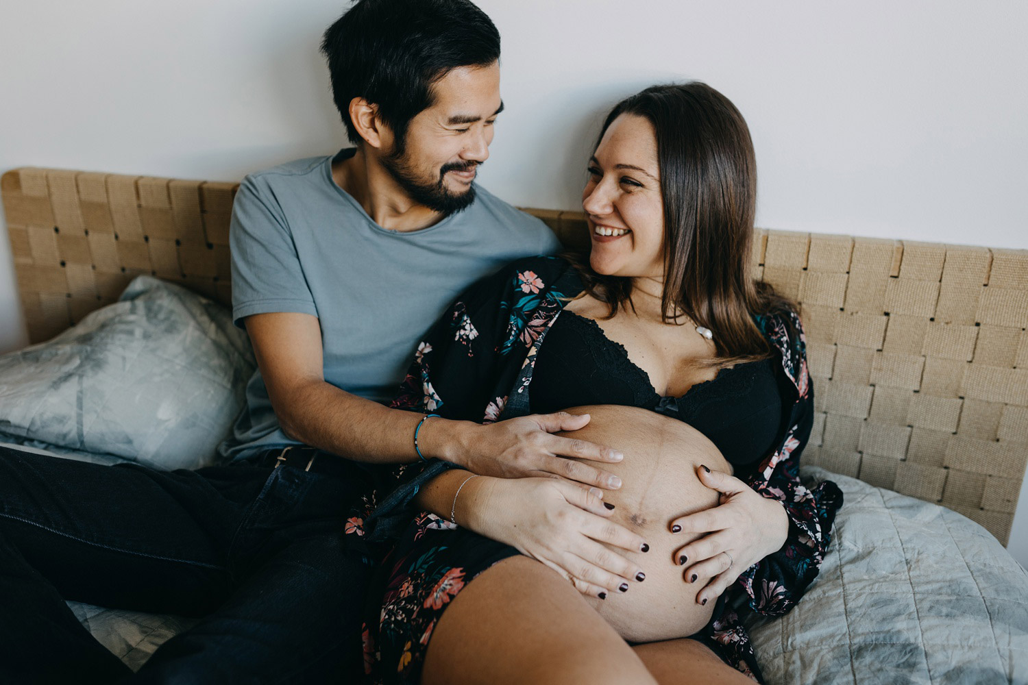 couple expecting a baby posing for maternity photos in Copenhagen