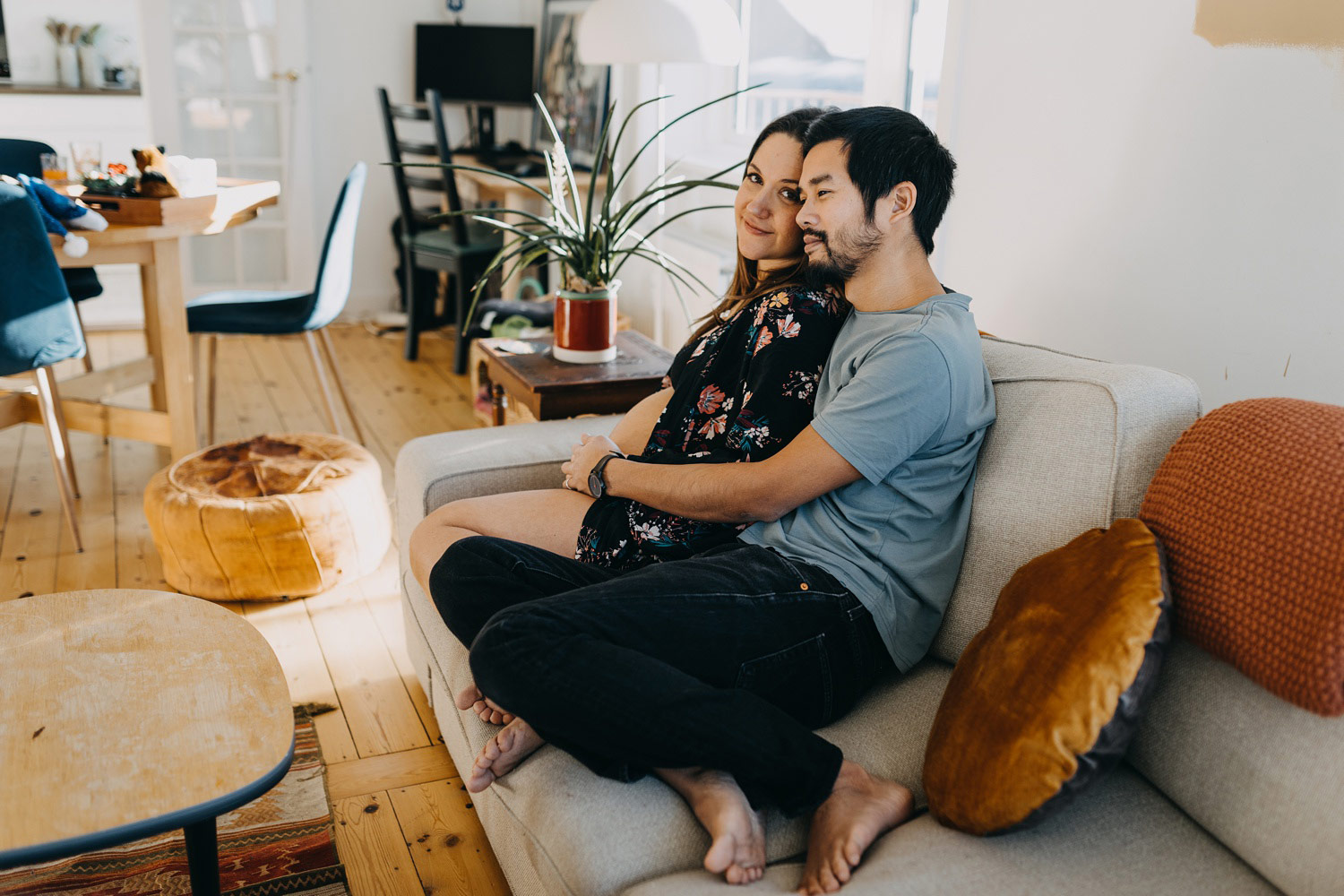 couple expecting baby hanging out at home in Copenhagen