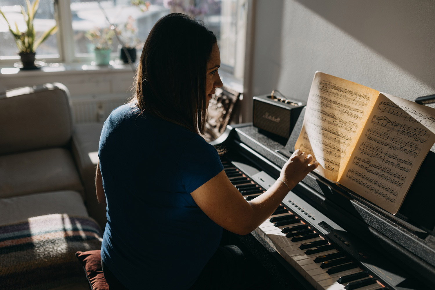 pregnant woman playing the piano 