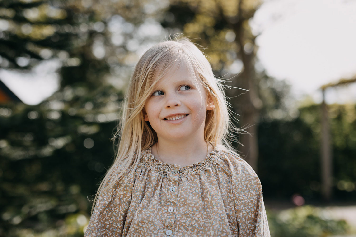 Portrait photography in Copenhagen: A close-up of a girl smiling and looking happy