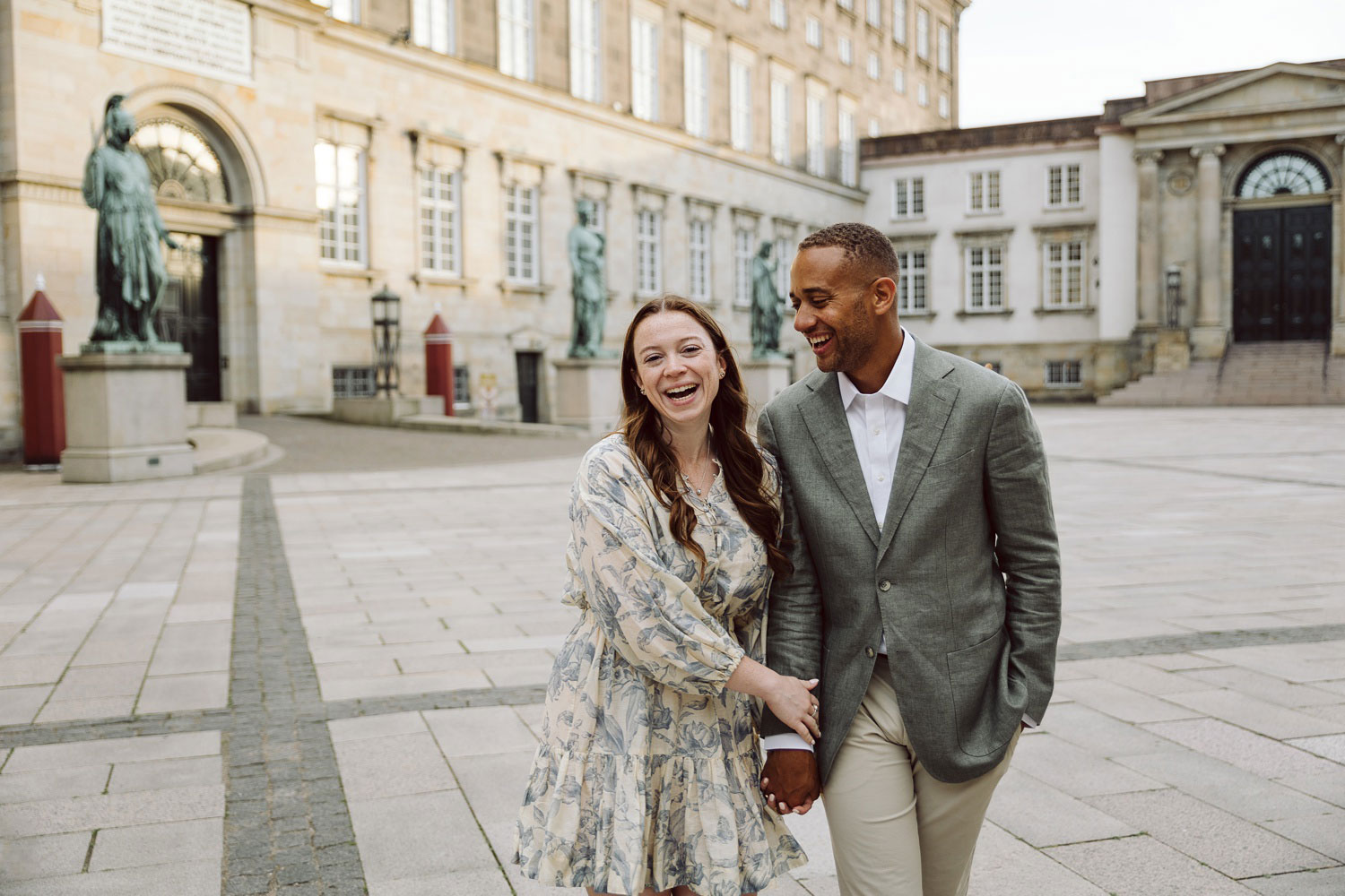 Candid moment of laughter between a newly engaged couple in Copenhagen