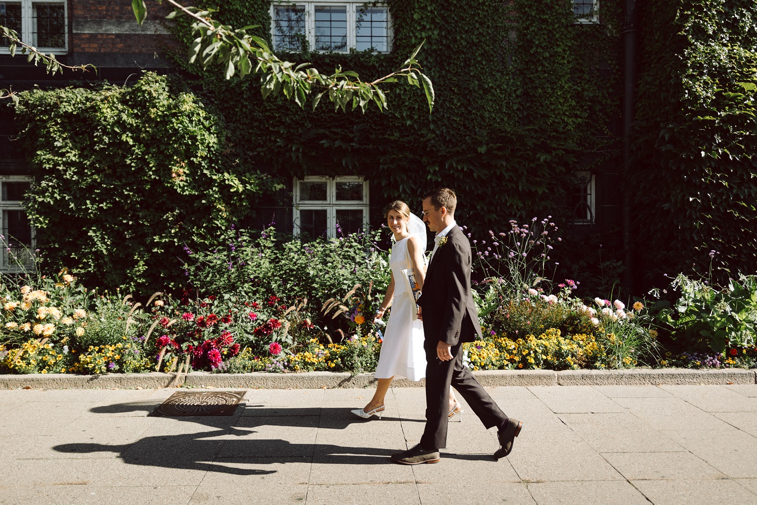 Bride and groom exiting Copenhagen City Hall after their wedding 